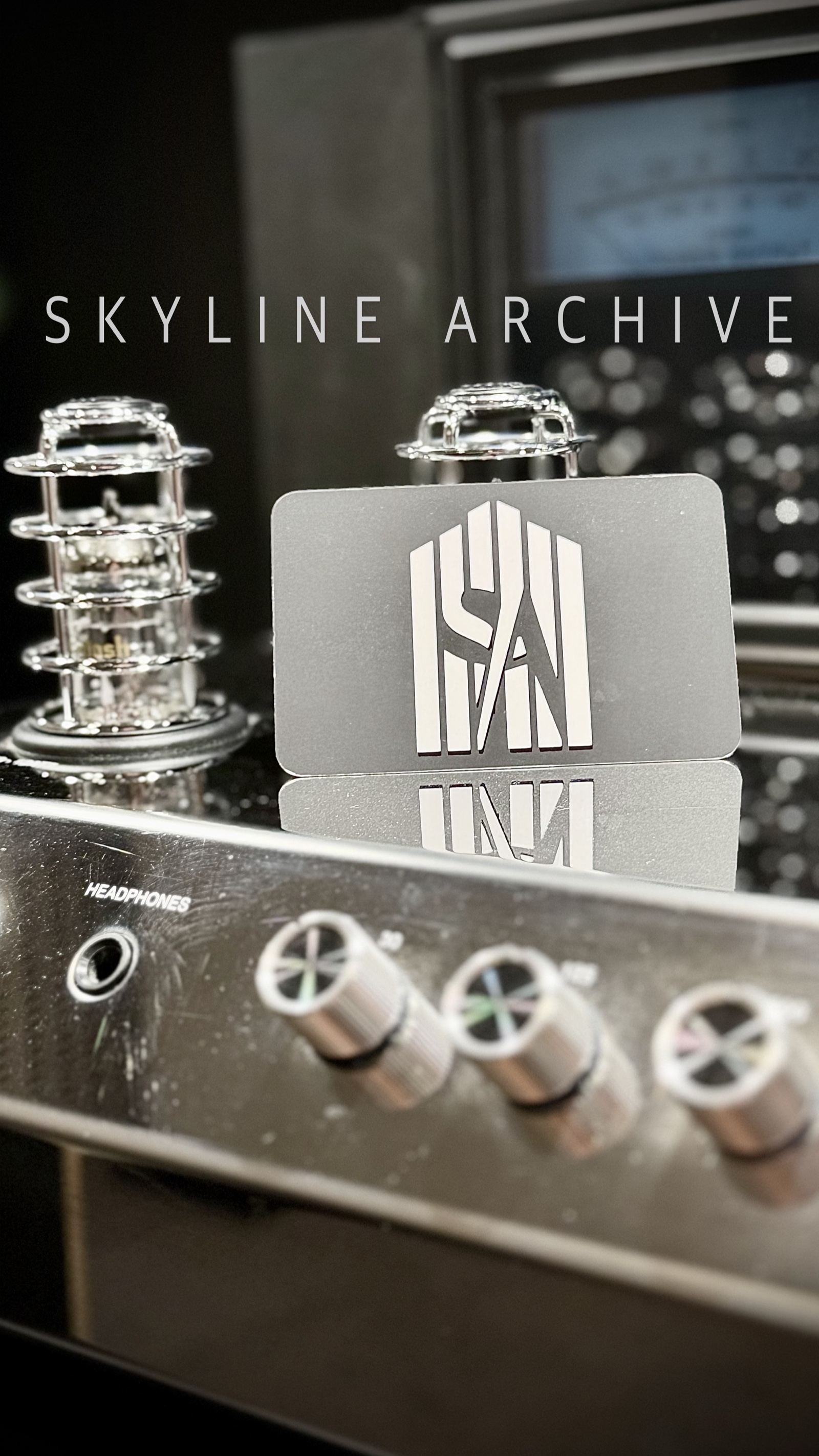 Skyline Archive metal card photographed among audio electronics and studio hardware